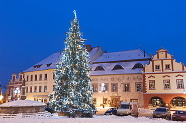 Snow-covered Christmas Tree and Renaissance buildings, Jihocesky, Czech Republic, Europe 