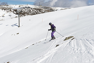 Young skier skiing The Chute, Mount Hotham, Victoria, Australia, Pacific