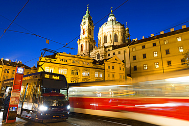 Trams below Baroque St. Nicholas Church, Malostranske Square, Lesser Town (Mala Strana), Prague, Czechia, Europe