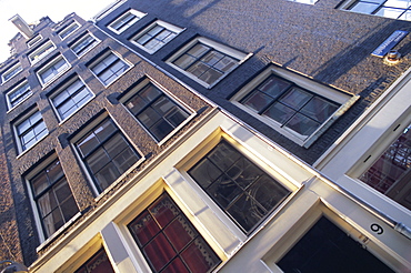 Detail of traditional Amersterdam house facade at Singel canal, Amsterdam, Holland (The Netherlands), Europe