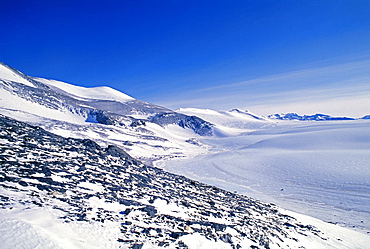 Blue ice bordering the mountain range, Ellsworth Mountains at Patriot Hills, Antarctica, Polar Regions