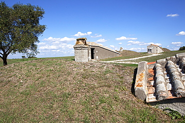 Vew of the Necropolis of Monterozzi with the entrances built as a protection to the ancient Etruscan tombs, UNESCO World Heritage Site, Tarquinia, Lazio, Italy, Europe