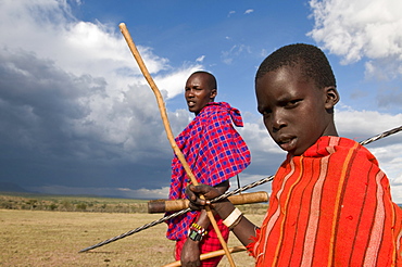 Masai boy with his father, Masai Mara, Kenya, East Africa, Africa