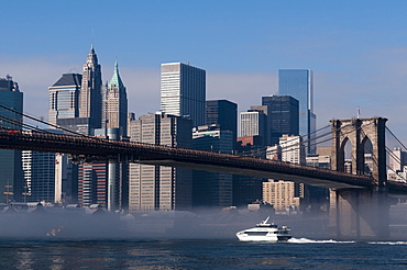 Brooklyn Bridge and New York City skyline in the morning mist, New York City, United States of America, North America