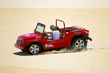 Dune buggy on sand dunes, Pitangui, Natal, Rio Grande do Norte state, Brazil, South America