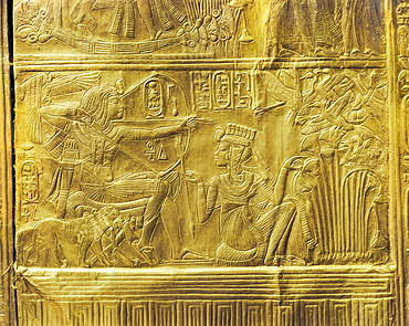 Detail of the exterior of the gilt shrine showing the queen helping the king in a ritual hunting scene, from the tomb of the pharaoh Tutankhamun, discovered in the Valley of the Kings, Thebes, Egypt, North Africa, Africa
