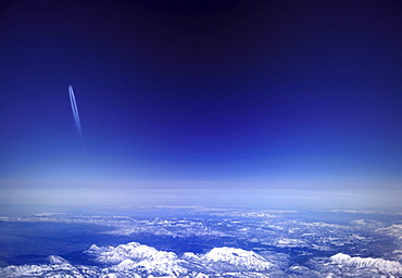 Aircraft vapour trails above clouds over Colorado, United States of America, North America