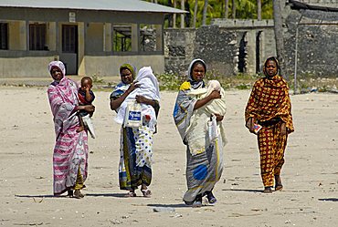 Woman with children through the fishing village, Zanzibar, United Republic of Tanzania, Africa
