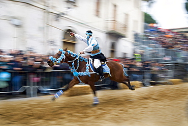 Horseman gallops to pierce the star with his sword, Sartiglia feast, Oristano, Sardinia, Italy, Europe