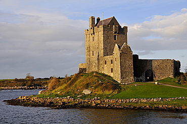 Dunguaire Castle at sunset near Kinvarra, Galway Bay, County Galway, Republic of Ireland, Europe