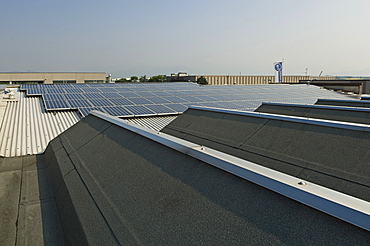 solar power system on factory, azzano san paolo, italy