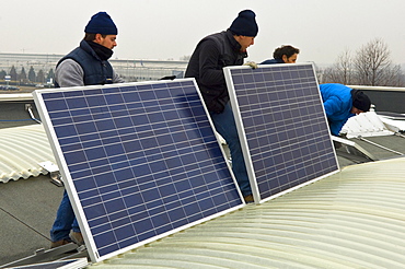 solar power system on factory roof, mapello, italy