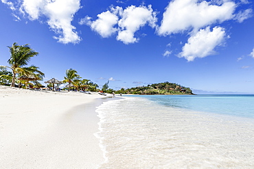 Palm trees and white sand surround the turquoise Caribbean Sea, Ffryers Beach, Antigua and Barbuda, Leeward Islands, West Indies