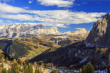 The colorful woods frame the landscape and the high peaks in autumn Gardena Pass, Trentino-Alto Adige, Italy, Europe