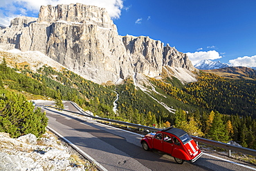 Citroen 2 CV on the road from Sella Pass, Trentino-Alto Adige, Italy, Europe