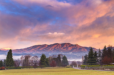 Sunrise at Azzate Belvedere. Campo dei Fiori and Sacro Monte di Varese are visible at the top of the mountains. Azzate, Varese, Lombardy, Italy, Europe