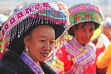 Chinese woman in traditional Miao attire during the Heqing Qifeng Pear Flower festival, China