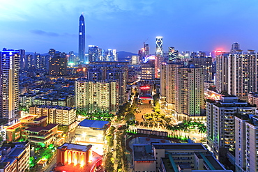 Shenzhen skyline at twilight with the tallest building of the city on background: the Ping An IFC, China