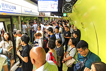 Commuters waiting for a train in the MTR Wan Chai in Hong Kong, China