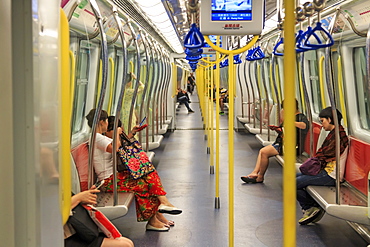 Commuters inside a train of the MTR of Hong Kong, the most popular mean of transportation in the city, China