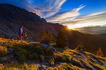 Mountain bikers at sunset, Carezza, Latemar, Trentino-AltoAdige, Dolomites, Italy, Europe