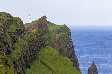 The lighthouse on Mykinesholmur, The island Mykines, part of the Faroe Islands in the North Atlantic, Denmark, Northern Europe