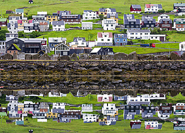 Small town Midvagur on the island of  Vagar, part of the Faroe Islands.   Europe, Northern Europe, Denmark, Faroe Islands