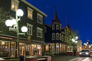 Akureyri during winter, Hafnarstraeti in the town center. The traffic calmed street is kept snow and ice free by a heating system powered by geothermal energy. Akureyri  is Icelands second largest city, second only the Reykjavik area. europe, northern europe, iceland,  March