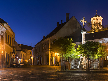 Szentendre near Budapest, a historic small town on the banks of the Danube. Dusk at Foe Ter (mains square) in  the old town with the church of John the Baptist.  Europe, Eastern Europe, Hungary, October