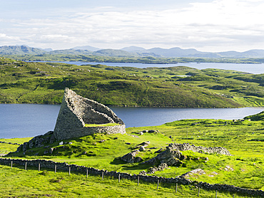 Dun Carloway Broch (Doune Carlabhagh) dating back to the Iron Age, a landmark of the Isle of Lewis.  Europe, Scotland, June