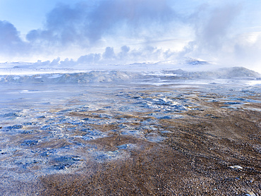 Geothermal area Hveraroend near lake  Myvatn and the ring road during winter with mud pools , fumaroles and solfataras.  europe, northern europe, scandinavia, iceland,  February