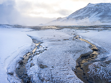 Geothermal area Hveraroend near lake  Myvatn and the ring road during winter with mud pools , fumaroles and solfataras.  europe, northern europe, scandinavia, iceland,  February