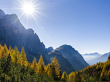 Valle Corpassa in the  Civetta - Moiazza mountain range in the dolomites of the Veneto.  In the background the peaks of Pale di San Martino.  The Dolomites of the Veneto are part of the UNESCO world heritage. Europe, Central Europe, Italy, October