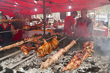 Porceddu, roast baby pork wrapped around a spit, Cordula made up of braided and cooked kid or lamb intestines wrapped around a spit, typical Sardinia recipe, Campidano, Sardinia, Italy, Europe