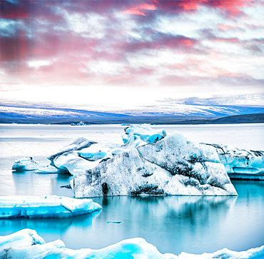 Jokulsarlon lake with icebergs at night, Iceland. Long exposure view at sunset