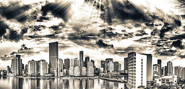 Panoramic aerial view of Downtown Miami and Brickell Key at sunrise.