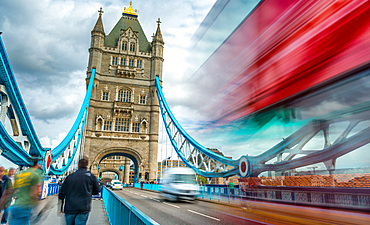 Blurred traffic under Tower Bridge, London.