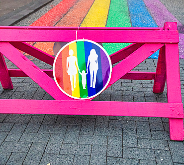 LGBT street sign with rainbow street representing peace.