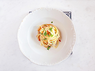 Spaghetti pasta with anchovy sauce, Colatura, parsley and fresh chilli. Cetara, Amalfi Coast, Campania, Italy; Europe