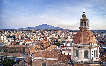 Aerial view of the dome and roofs of the Benedictine Monastery and in the background the Etna Volcano, Catania, Sicily, Italy, Europe