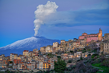 Cityscape of Centuripe and in the background the erupting Volcano Etna, Sicily, Italy, Europe