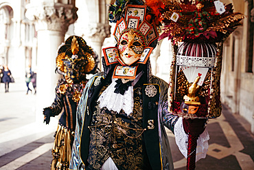 Portrait of a couple with beautiful masks in Venice, Veneto, Italy, Europe