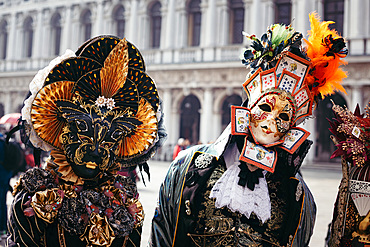 Portrait of a couple with beautiful masks in Venice, Veneto, Italy, Europe