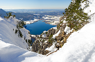 View towards lake Kochelsee and the foothills of the Alps near Munich. View from Mt. Jochberg near lake Walchensee during winter in the bavarian Alps. Europe Germany, Bavaria