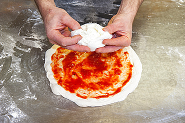 The preparation of a classic Margherita pizza, Italy, Step 08