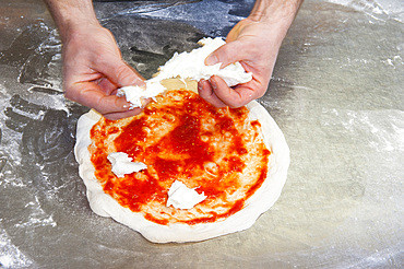 The preparation of a classic Margherita pizza, Italy, Step 09