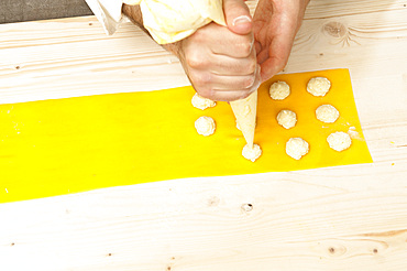 Making Tortelli from fresh pasta by hand. Italy