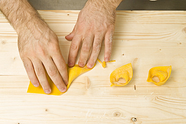 Making Tortelli from fresh pasta by hand. Italy