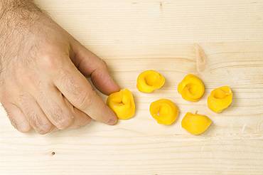 Making Tortelli from fresh pasta by hand. Italy