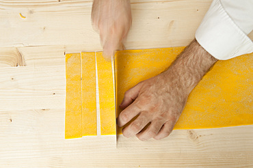 Making Farfalle out of fresh pasta by hand. Italy